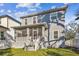 Charming two-story home with a screened porch and a well-maintained lawn at 7403 S Obrien St, Tampa, FL 33616