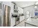 Contemporary kitchen with stainless steel appliances, light granite countertops, and stylish cabinets at 7403 S Obrien St, Tampa, FL 33616