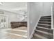 Open-concept living room with a cozy sectional couch, a ceiling fan, and plenty of natural light at 7403 S Obrien St, Tampa, FL 33616