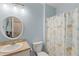 Bathroom featuring a shower/tub combo with matching nautical themed shower curtain at 7497 W Lenox Cir, Punta Gorda, FL 33950