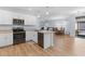Bright and airy kitchen with modern appliances, an island and opens to the dining and living area at 7497 W Lenox Cir, Punta Gorda, FL 33950