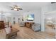 Open-concept living area with hardwood floors, modern decor, and lots of natural light at 7497 W Lenox Cir, Punta Gorda, FL 33950
