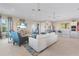 Bright living room with stylish decor, comfortable seating, and an adjacent kitchenette at 7497 W Lenox Cir, Punta Gorda, FL 33950