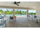 Inviting poolside lounge area with seating and views of the pool and surrounding landscape at 7497 W Lenox Cir, Punta Gorda, FL 33950