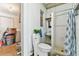 Small basement bathroom featuring a shower stall, toilet, and sink at 8013 Cardinal Dr, Tampa, FL 33617