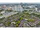 Community aerial featuring lush landscaping, tennis courts, and stunning city views at 846 Normandy Trace Rd, Tampa, FL 33602