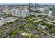 Drone's eye view of community featuring pool, lake, tennis courts, and downtown views at 846 Normandy Trace Rd, Tampa, FL 33602