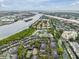 An aerial view of a neighborhood with waterfront access and community pool at 846 Normandy Trace Rd, Tampa, FL 33602