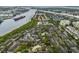 An aerial photo of a waterfront community featuring a pool and tennis courts at 846 Normandy Trace Rd, Tampa, FL 33602