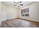 Bedroom with hardwood floors and a large window with backyard views at 846 Normandy Trace Rd, Tampa, FL 33602