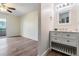 Bright room features a ceiling fan and an attached bathroom with a vanity sink at 846 Normandy Trace Rd, Tampa, FL 33602
