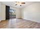 Spacious bedroom features a ceiling fan and sliding glass doors to a balcony at 846 Normandy Trace Rd, Tampa, FL 33602