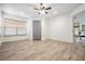 Bedroom with wood-look floors, a ceiling fan, a window with blinds, and closet at 846 Normandy Trace Rd, Tampa, FL 33602