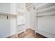 Walk-in closet with custom shelving and drawers to maximize storage space at 846 Normandy Trace Rd, Tampa, FL 33602