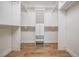Walk-in closet with custom shelving and drawers to maximize storage space at 846 Normandy Trace Rd, Tampa, FL 33602