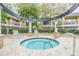 Relaxing community hot tub with seating, surrounded by landscaping and nearby apartments at 846 Normandy Trace Rd, Tampa, FL 33602