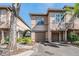 Inviting townhome with neutral paint, attached garage, and lush landscaping at 846 Normandy Trace Rd, Tampa, FL 33602