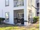 Exterior view of a balcony with a grill and screened in patio at 8517 Sea Harbour Ln # 103, Temple Terrace, FL 33637