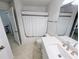 Clean, renovated bathroom with tile floors, a shower-tub combination, and a new vanity with solid surface countertop at 8517 Sea Harbour Ln # 103, Temple Terrace, FL 33637