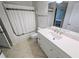 Clean, renovated bathroom with tile floors, a shower-tub combination, and a new vanity with solid surface countertop at 8517 Sea Harbour Ln # 103, Temple Terrace, FL 33637