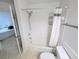 Clean bathroom featuring a shower-tub combination with white tiled walls and chrome fixtures at 8517 Sea Harbour Ln # 103, Temple Terrace, FL 33637