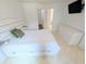 Bright bedroom featuring a ceiling fan, TV, and a modern bed frame with built-in storage drawers at 8517 Sea Harbour Ln # 103, Temple Terrace, FL 33637