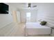Bedroom featuring neutral tile flooring, white walls and a ceiling fan at 8517 Sea Harbour Ln # 103, Temple Terrace, FL 33637
