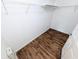Walk-in closet with wood-look floors and a wire shelving system for storage at 8517 Sea Harbour Ln # 103, Temple Terrace, FL 33637
