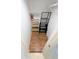 Walk-in closet with wood-look floors and built-in shelving for optimal storage at 8517 Sea Harbour Ln # 103, Temple Terrace, FL 33637
