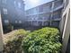 Courtyard with green space and views of the building at 8517 Sea Harbour Ln # 103, Temple Terrace, FL 33637