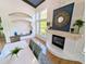 Bright dining room with fireplace, built-in seating, and large windows, creating an inviting atmosphere at 8517 Sea Harbour Ln # 103, Temple Terrace, FL 33637