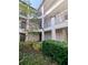 Exterior of building showing units and balconies with landscaping at 8517 Sea Harbour Ln # 103, Temple Terrace, FL 33637