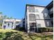 Building exterior featuring screened balconies and patios at 8517 Sea Harbour Ln # 103, Temple Terrace, FL 33637