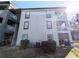 Side view of a building with balconies and screen patios at 8517 Sea Harbour Ln # 103, Temple Terrace, FL 33637