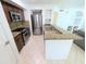 Bright kitchen boasts stainless steel appliances, granite countertops, and plenty of cabinet space for the modern home chef at 8517 Sea Harbour Ln # 103, Temple Terrace, FL 33637