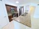Modern kitchen with stainless steel appliances, granite countertops, and plenty of cabinet space for storage at 8517 Sea Harbour Ln # 103, Temple Terrace, FL 33637