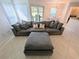 Inviting living area with a sectional sofa, tile flooring, and an adjacent dining space at 8517 Sea Harbour Ln # 103, Temple Terrace, FL 33637