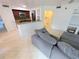 Inviting living room with neutral tones, tile flooring, and seamless flow to the adjacent kitchen at 8517 Sea Harbour Ln # 103, Temple Terrace, FL 33637