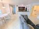 Comfortable living space with neutral tile flooring, and an open flow to the kitchen and dining area at 8517 Sea Harbour Ln # 103, Temple Terrace, FL 33637