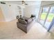 Comfortable living room featuring a spacious sectional sofa, tile floors, and plenty of natural light at 8517 Sea Harbour Ln # 103, Temple Terrace, FL 33637
