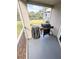 Outdoor patio features grill and view of complex at 8517 Sea Harbour Ln # 103, Temple Terrace, FL 33637