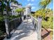 Picturesque walkway with lush landscaping and building features in the background at 8517 Sea Harbour Ln # 103, Temple Terrace, FL 33637