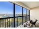 Balcony overlooking water with outdoor seating perfect for enjoying the views at 9425 Blind Pass Rd # 506, St Pete Beach, FL 33706
