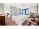 Bright bedroom with water views, light color scheme, and comfortable seating at 9425 Blind Pass Rd # 506, St Pete Beach, FL 33706