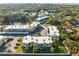 Residential complex nestled among trees and ponds, featuring well-maintained landscaping at 952 Virginia St # 108, Dunedin, FL 34698