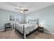 Cozy bedroom featuring a ceiling fan, natural light from the window, and a comfortable bed at 952 Virginia St # 108, Dunedin, FL 34698