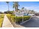 Heather Lake Condominiums featuring lush tropical landscaping and convenient covered parking spaces at 952 Virginia St # 108, Dunedin, FL 34698