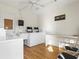 Functional laundry room with modern washers, a utility sink, and plenty of counter space at 952 Virginia St # 108, Dunedin, FL 34698