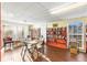 Cozy library with extensive book collection, comfortable seating and natural light at 952 Virginia St # 108, Dunedin, FL 34698