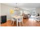 Living area with an open layout, chandelier, and a view of the sitting room at 952 Virginia St # 108, Dunedin, FL 34698